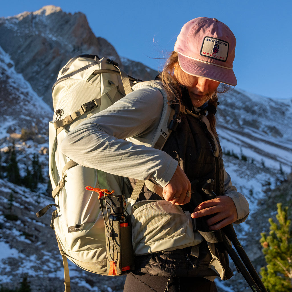 Person with a large backpack in a mountainous landscape