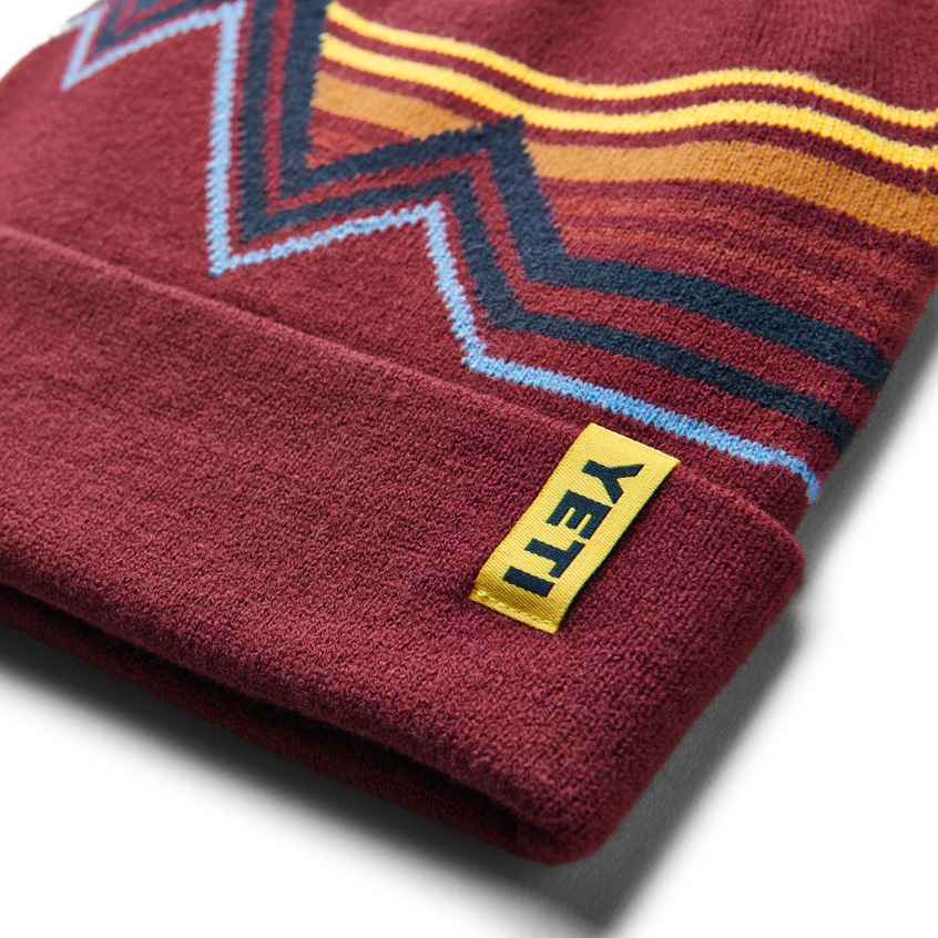 YETI Freestyle-beanie met pompon Rust/Yellow